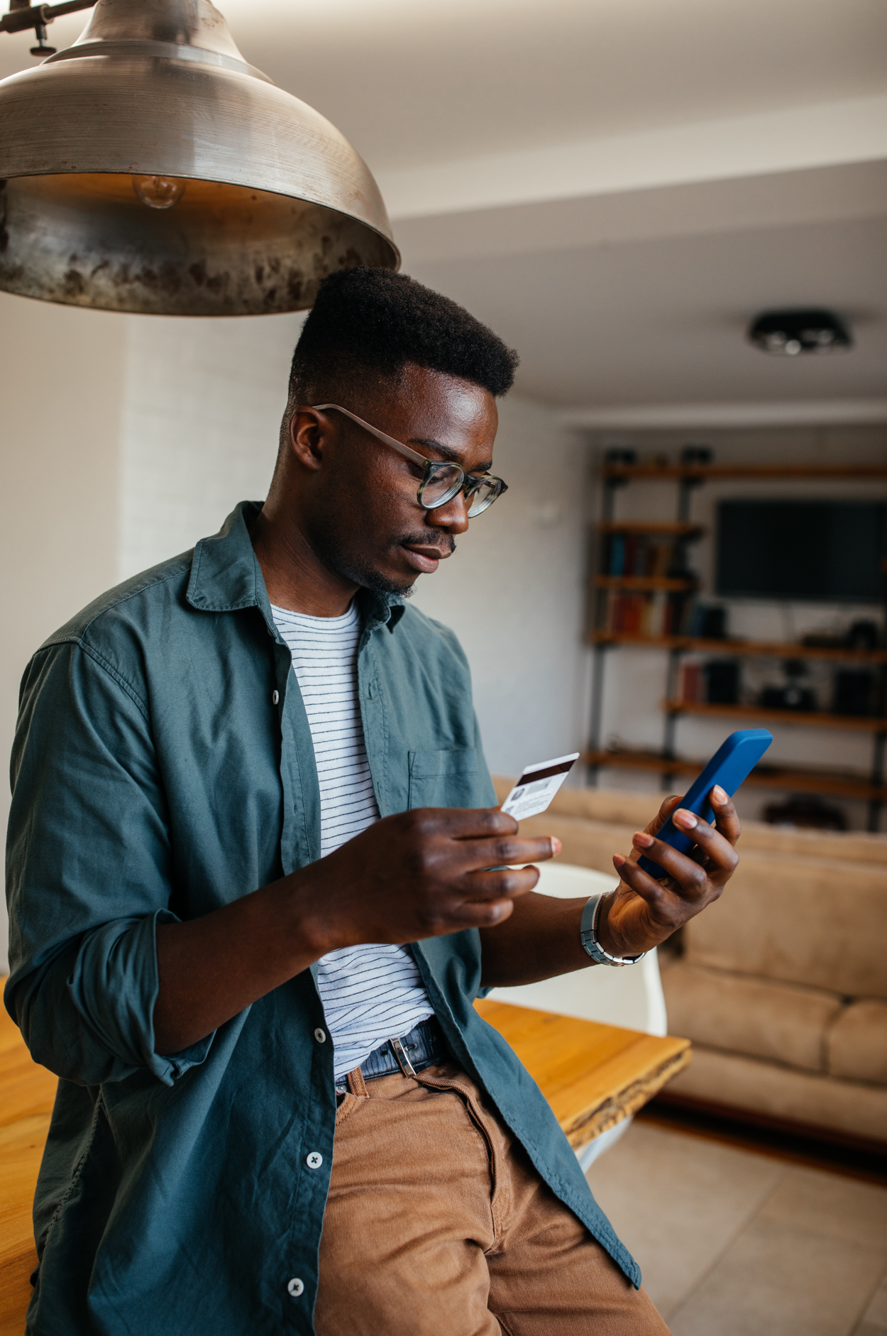 a man looking down at his cellphone